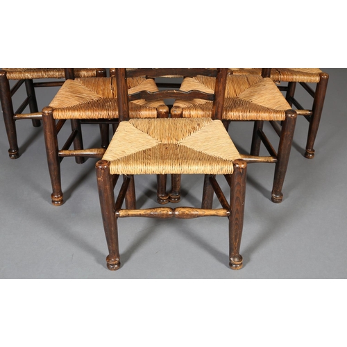 378 - A SET OF SIX 19TH CENTURY ELM WAVY LADDER BACK SINGLE CHAIRS, rush seated, on turned legs and front ... 