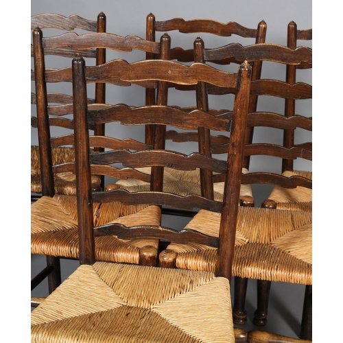 378 - A SET OF SIX 19TH CENTURY ELM WAVY LADDER BACK SINGLE CHAIRS, rush seated, on turned legs and front ... 