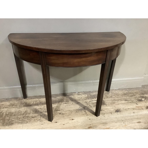 385 - A 19th century mahogany demi-lune side table on moulded square legs