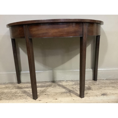 385 - A 19th century mahogany demi-lune side table on moulded square legs