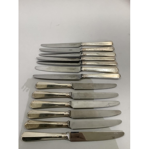 238 - Thirteen silver handled knives of conforming style, six Sheffield 1993 and 1994, H L Brown, two Shef... 