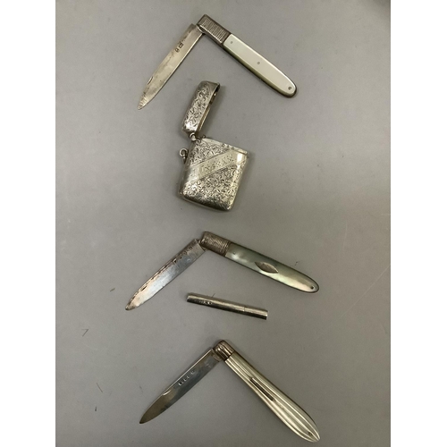 260 - Three silver and mother-of-pearl fruit knives, a toothpick holder and a vesta