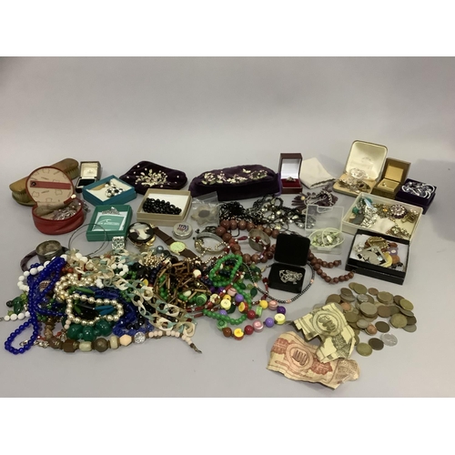 296 - A quantity of costume jewellery, mainly beads but also including brooches, bracelets, wristwatch etc... 