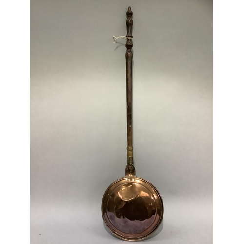 208 - A 19th century copper warming pan on turned wood handle