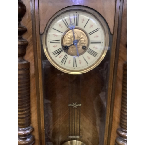 339 - A 19th century walnut wall clock having a eagle finial to the pediment, split turned pilasters to th... 