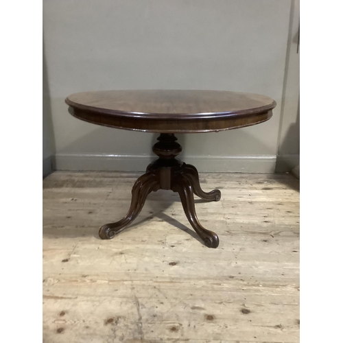 379 - A 19th century mahogany oval tilt top breakfast table on turned pedestal with four cabriole legs, 13... 