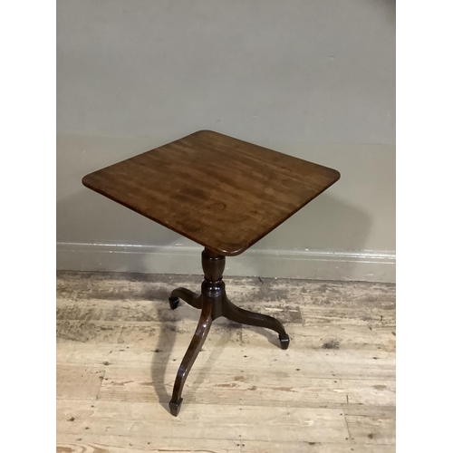 383 - A early 19th century mahogany pedestal table having a rectangular snap top, on a vase turned column ... 