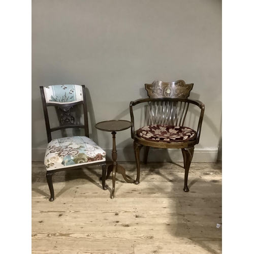 384 - An Edwardian mahogany and rosewood occasional chair inlaid in satinwood and ivorine with a face mask... 