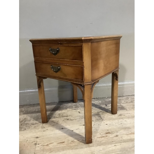 396B - A reproduction walnut lamp table, square with canted corners having two drawers with swing handles a... 