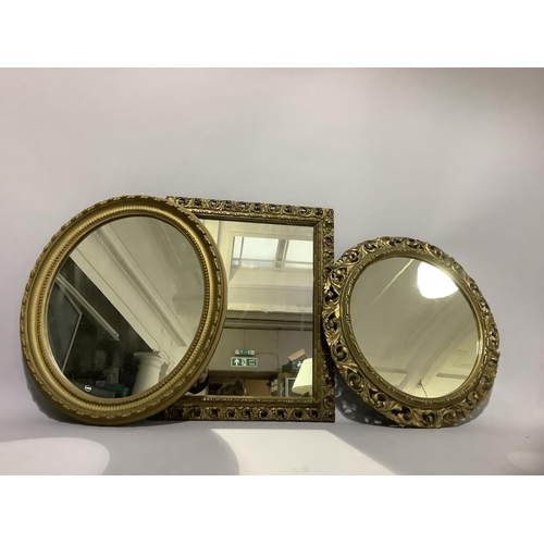 397B - Three gilt framed mirrors, circular, oval and rectangular