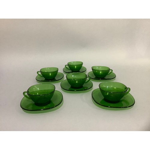 12 - A set of twelve French green glass coffee cups and saucers