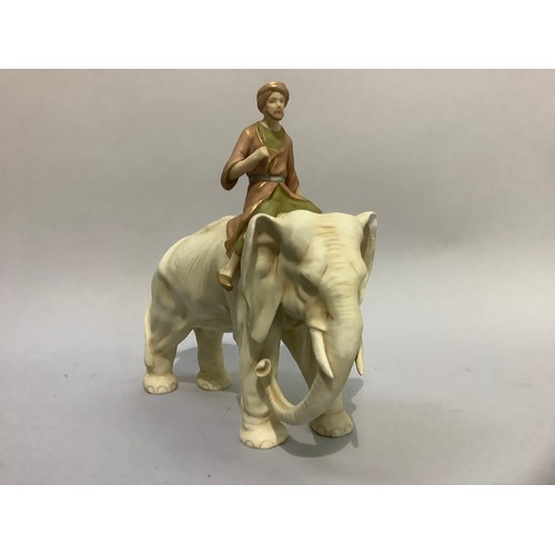 42 - A Royal Dux style figure of an elephant and mahout