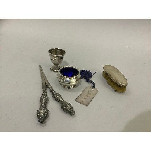 245 - A pair of Edward VII silver handled glove stretchers Birmingham 1901, a child's hair brush, 1926, a ... 