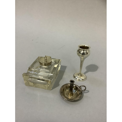 216 - A silver lidded glass ink well of rectangular form with pen rest, 6cm by 7.5cm together with a minia... 