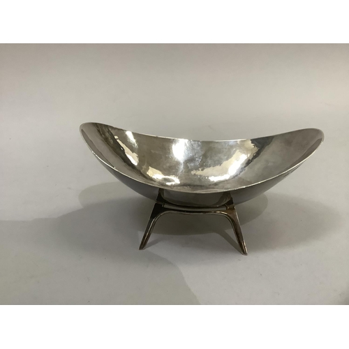 262 - Silver planished bonbon dish, oval, on four plain legs, Chester 1958, approximate weight 4oz