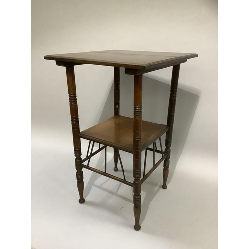 377 - An aesthetic walnut occasional table of square outline on ring turned legs joined by an under tier a... 