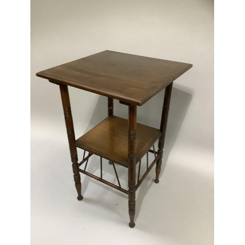 377 - An aesthetic walnut occasional table of square outline on ring turned legs joined by an under tier a... 