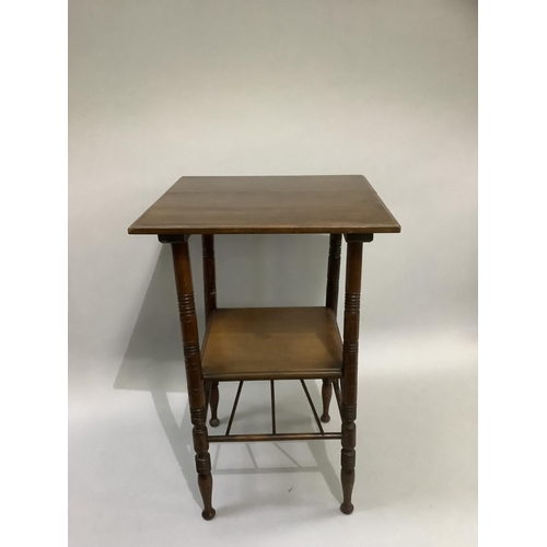 377 - An aesthetic walnut occasional table of square outline on ring turned legs joined by an under tier a... 