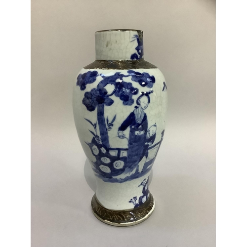 206 - A Chinese crackle glaze baluster vase painted in blue with figures in a garden landscape