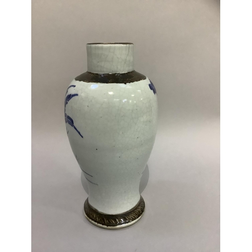 206 - A Chinese crackle glaze baluster vase painted in blue with figures in a garden landscape