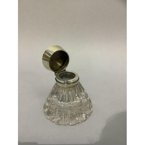 215 - A silver lidded glass ink well, London 1903 of panelled conical shape, initialled to the top, 9cm