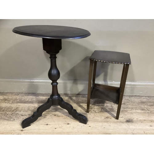 359 - A dark stain oval pedestal table on tripod base together with a small occasional table with undertie... 