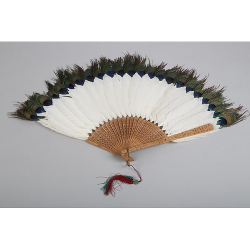 141 - Two 19th century Chinese white duck or goose feather fans, the first mounted on carved wood, the gor... 