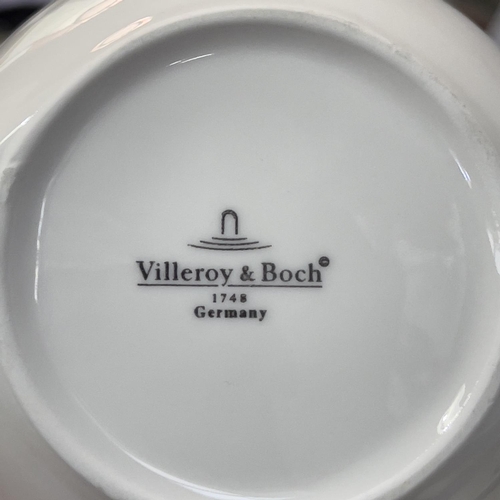 13 - A Villeroy and Boch New Wave dinner service comprising eight dinner plates 33cm by 23cm, seven pasta... 