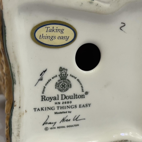 19 - A Royal Doulton figure 'Taking Things Easy' HN2680, 18cm high