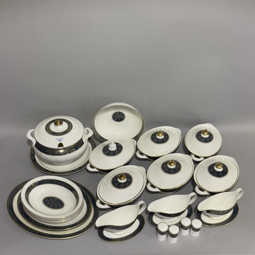 28 - An extensive Royal Doulton dinner, tea and coffee service of Carlyle pattern comprising 22 dinner pl... 