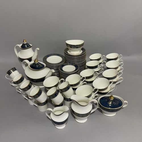 28 - An extensive Royal Doulton dinner, tea and coffee service of Carlyle pattern comprising 22 dinner pl... 