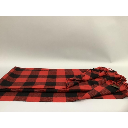 30 - A Joshua Ellis and Co Ltd 100% cashmere travel rug in red and black check