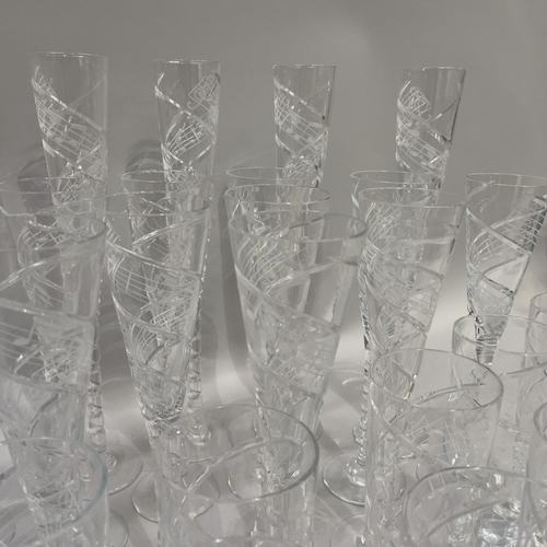 32 - A suite of Royal Brierley glasses, the funnel shaped bowls with long stem, riven cut and etched with... 