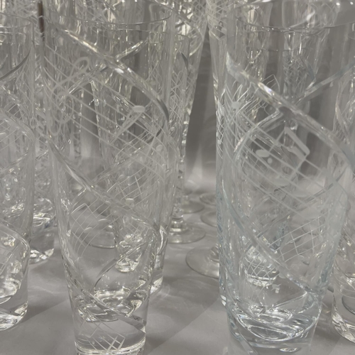 32 - A suite of Royal Brierley glasses, the funnel shaped bowls with long stem, riven cut and etched with... 