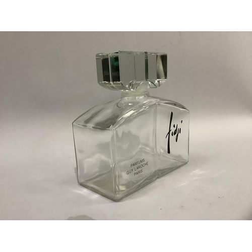 5 - A Factice Guy Laroche Fidji glass perfume bottle, 17cm high by 16.5cm wide, moulded with Parfums, Gu... 