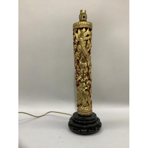 58 - A carved and gilded column table lamp of chinoiserie design with deities amongst clouds and sinuous ... 