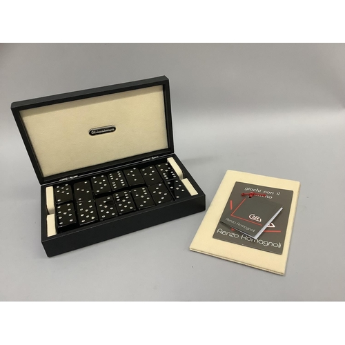 6 - An Italian set of black and diamante set dominoes contained in a black leather and cream suede case ... 