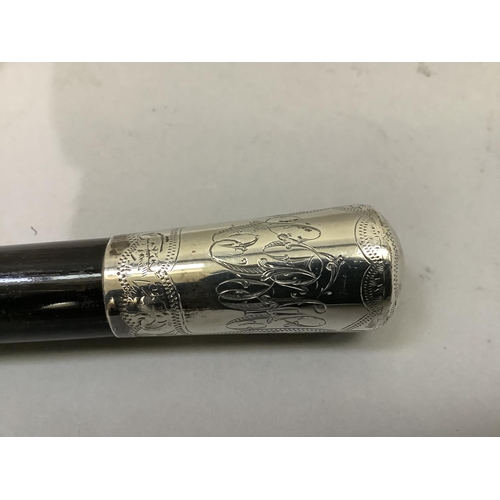 7 - A silver mounted ebonised baton engraved with initials to the cartouche