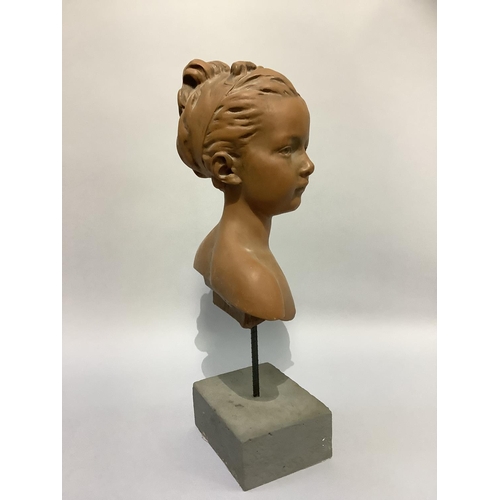 9 - A terracotta effect head and shoulders bust of a young girl, hair swept up in a band, overall height... 