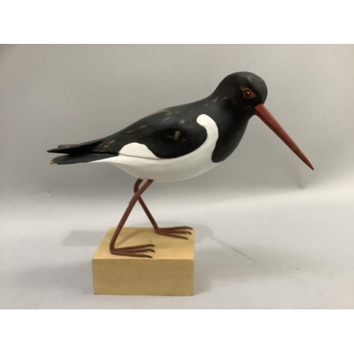 70 - A carved wood figure of an oyster catcher on wood block