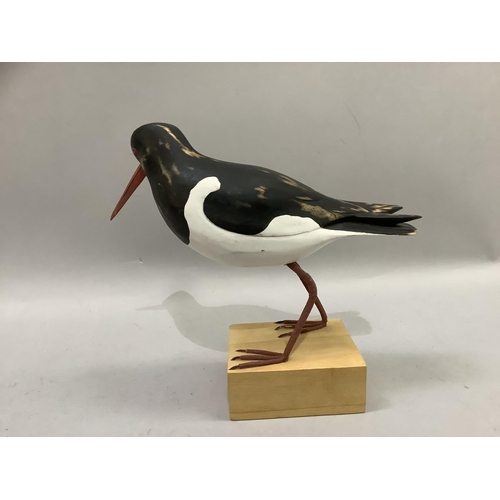 70 - A carved wood figure of an oyster catcher on wood block