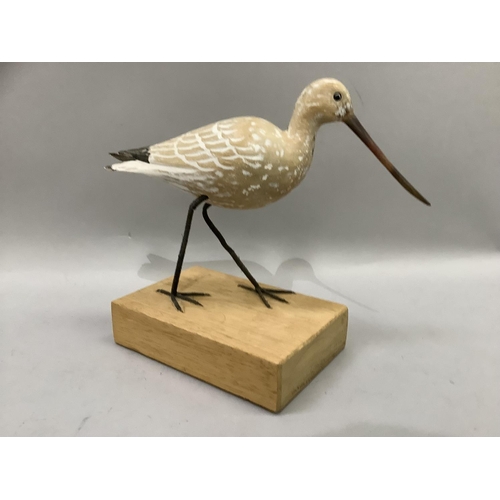 72 - A carved wood figure of a black tailed godwit, wading bird, on wooden block plinth, 25cm high