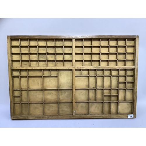 109 - A wooden typeset tray, 55.5cm x 85cm