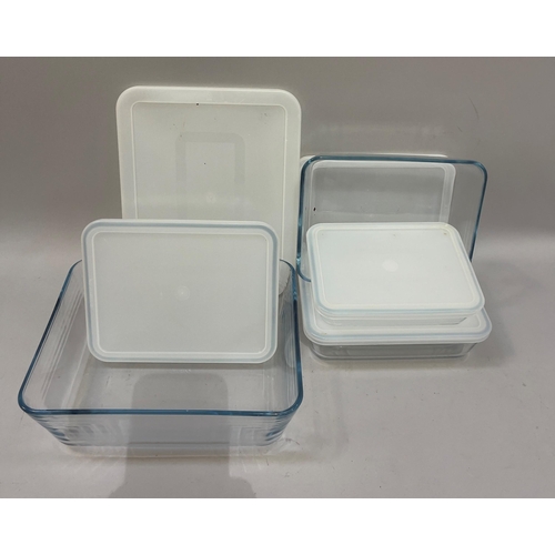 119 - A set of Pyrex ware dishes with plastic tops including four rectangular, one circular, and two gradu... 