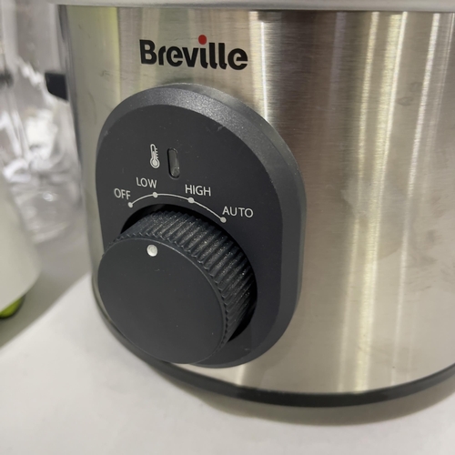 136 - A Breville slow cooker, a Breville blender with clear glass attachments and a Breville sandwich pres... 