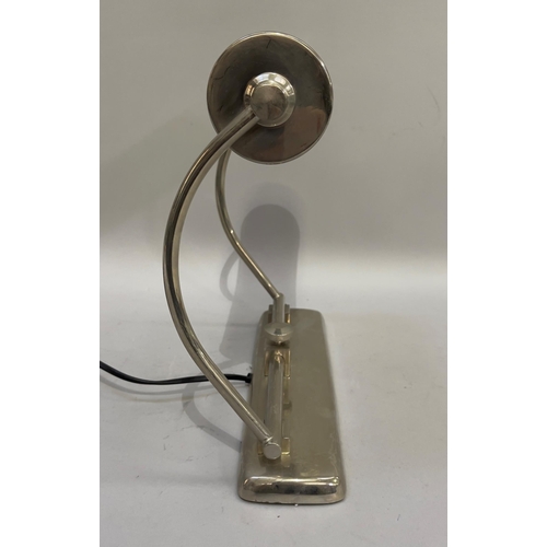 153 - A polished steel desk lamp