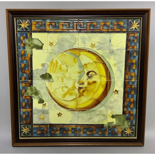 87 - A framed tiled plaque, glazed and tube-lined, with a moon within a surround of stars and Greek key b... 