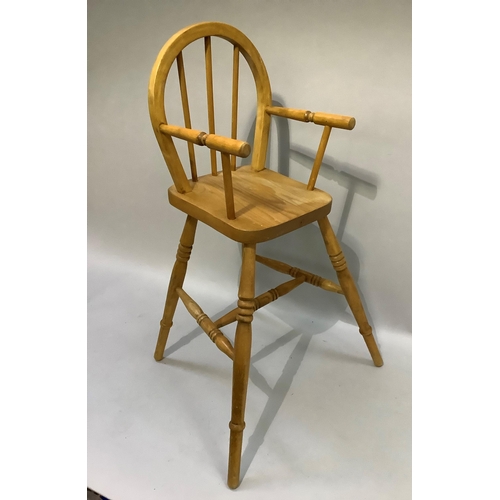 163 - A child's beech high chair with rail back