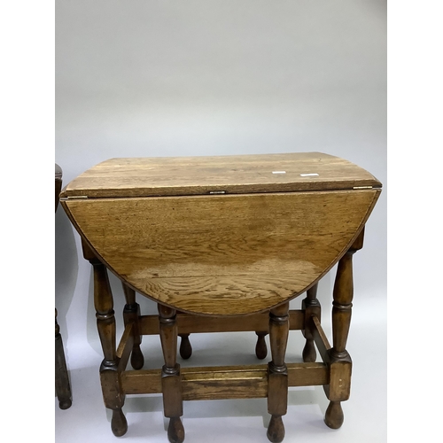 164 - A small oak oval drop leaf occasional table on turned framing together with an oak oval gateleg tabl... 