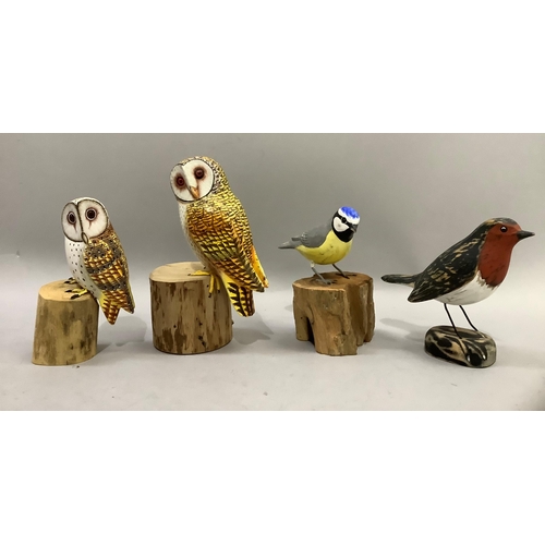 183 - Two painted wood owls perched on wood blocks, a blue tit and a robin